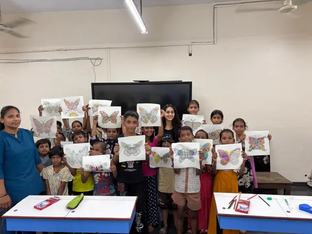 Children colouring their own mandala designs.
