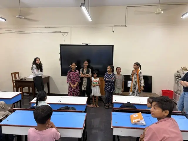The children performing songs and dances for their class.